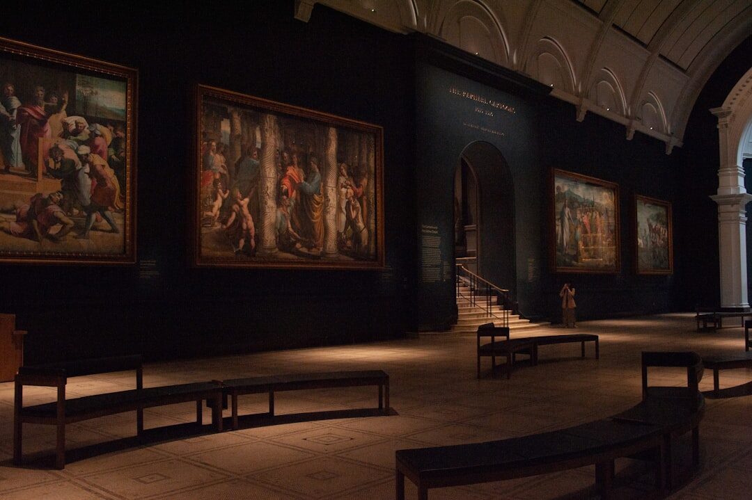 Interior of a quiet museum gallery with framed portraits